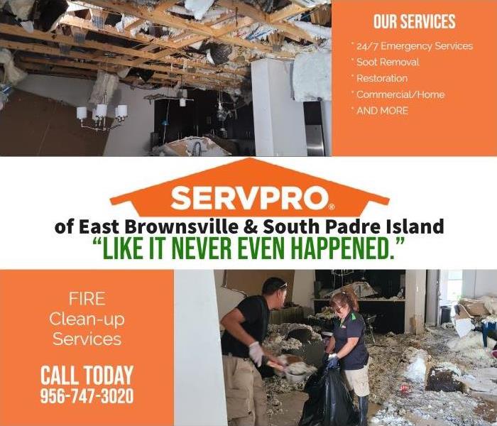fire damaged home with SERVPRO technicians cleaning up the damage 
