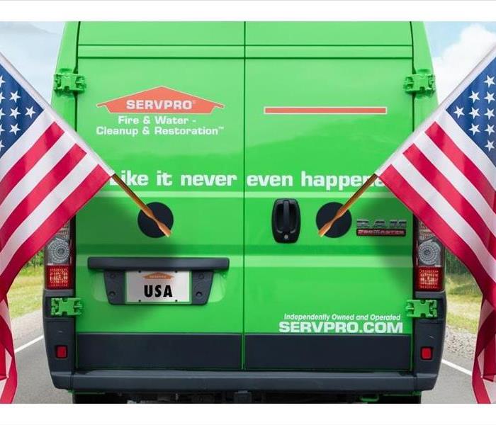 Happy Independence Day! Image of SERVPRO vehicle with American flags. 